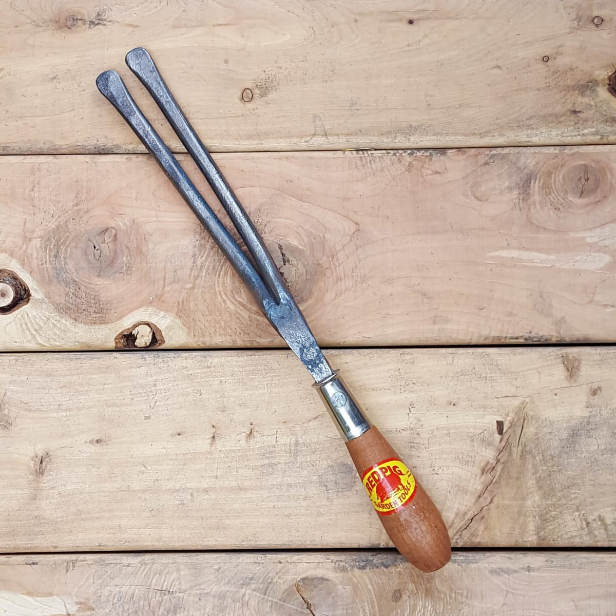 Bulb lifters have two prongs and round tips for getting under bulbs to lift them, without damaging them, for over winter regions.