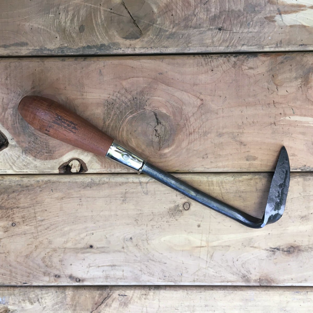 The back of the Cape Cod weeder is flat to get flat against the ground.