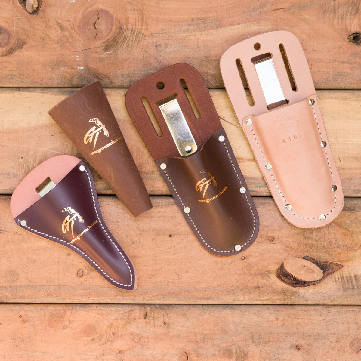 These four sheaths have metal clips at the back: scissor pouch, cone sheath, pruner pouch large, hand pruner pouch medium.