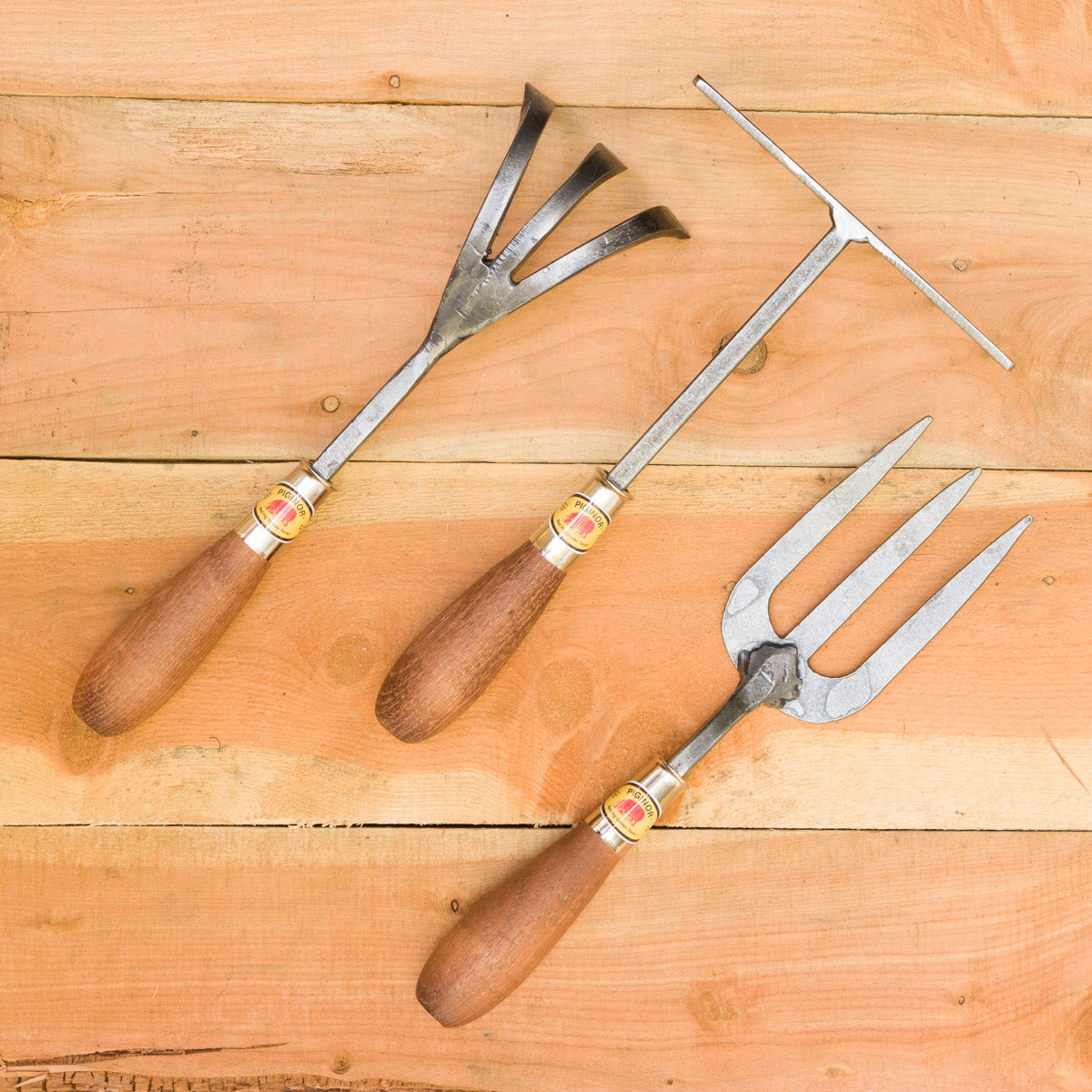 From left to right: Three Tine Cultivator, Hand Rake, English Fork