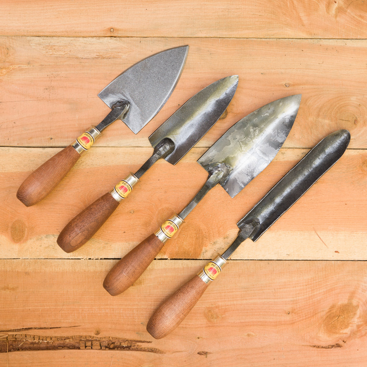Trowel Comparison from left to right: Flat Trowel, Planter's Trowel, Trowel, Dandelion Trowel