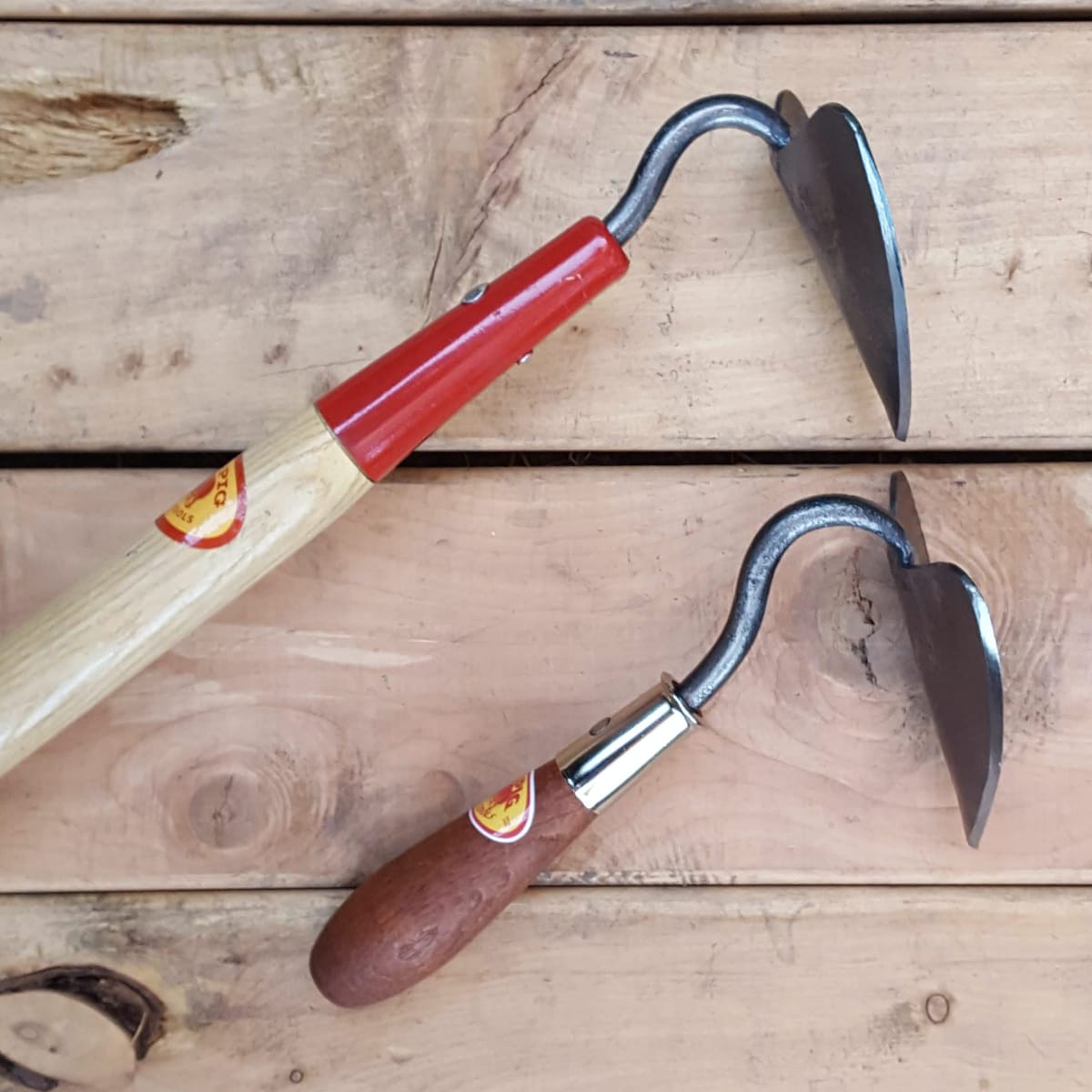 The small tool head (hand tool at right for comparison) is very slightly bent down the center for strength and to help with furrowing.