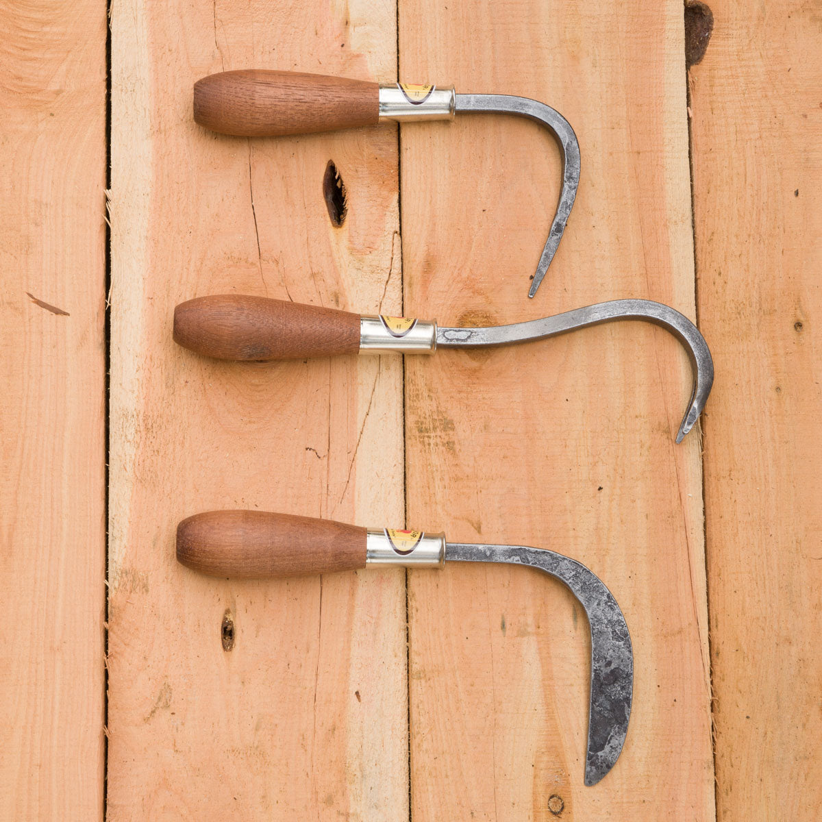 From top to bottom: root hook, weed yank, crevice weeder