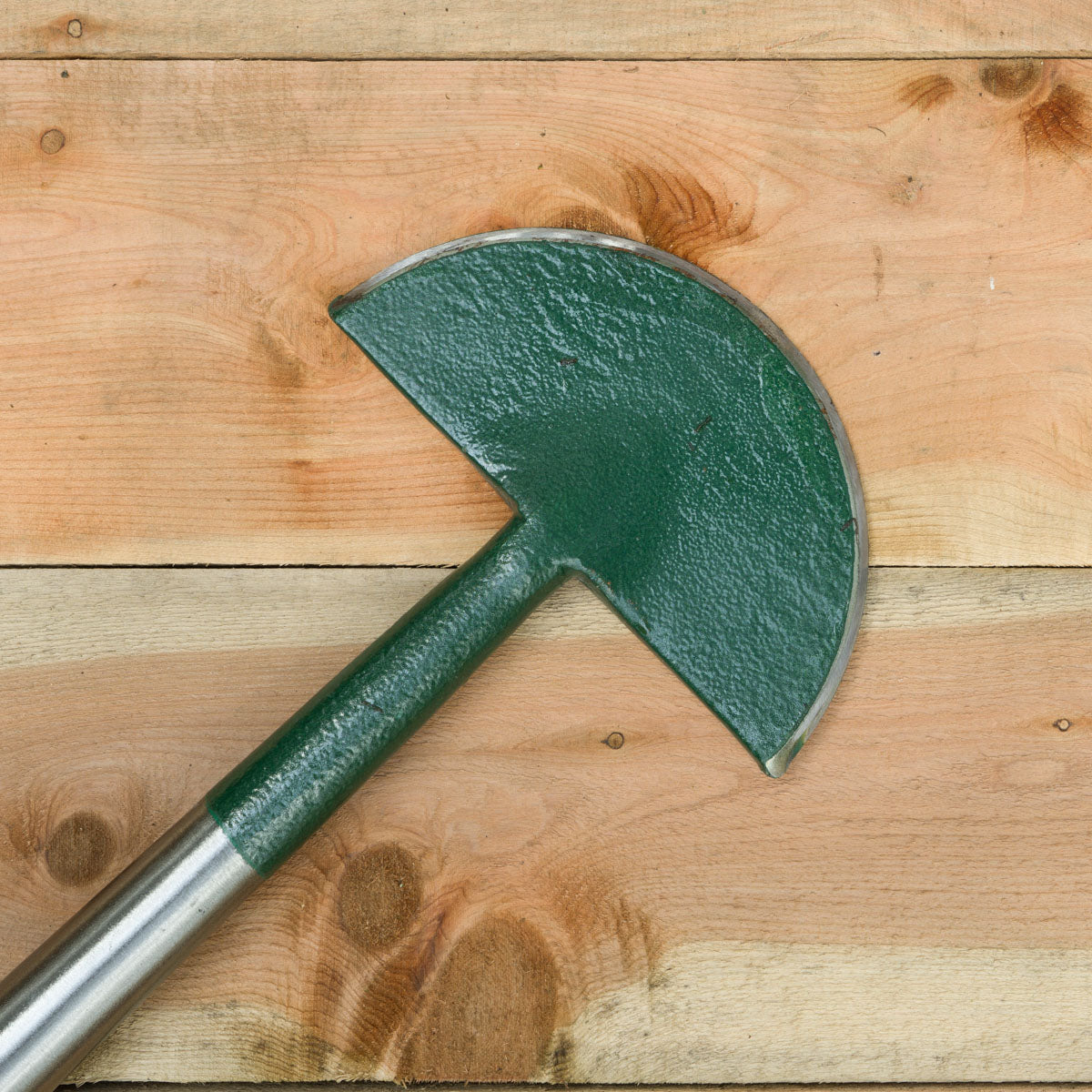 The edging knife, also known as a half-moon edger, is used to clean up garden and lawn borders.