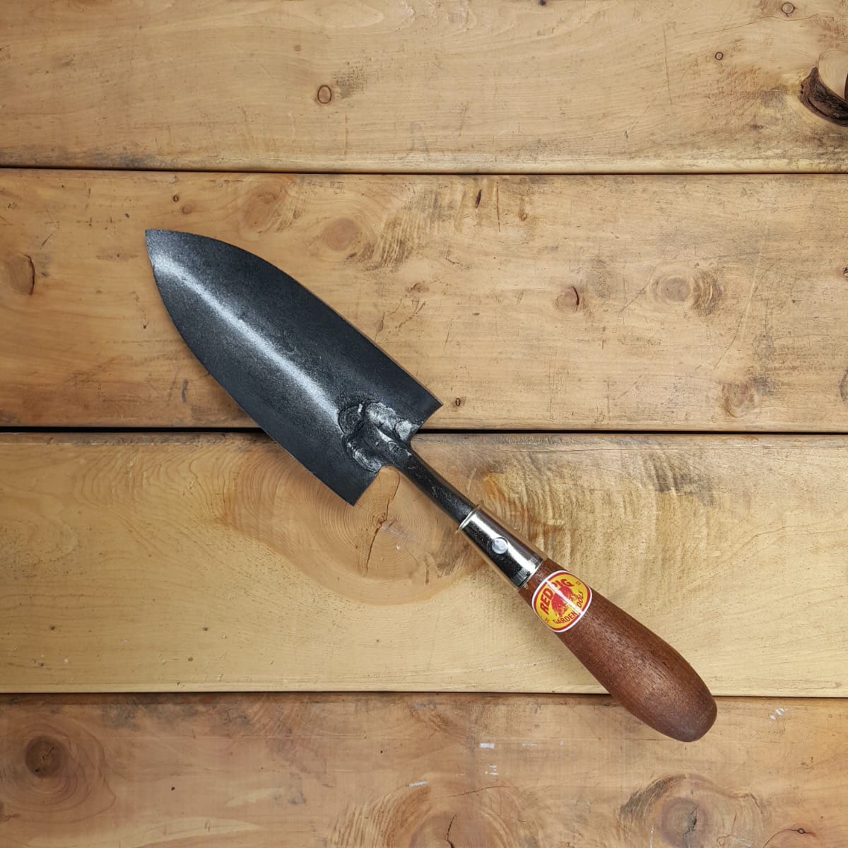 Transplant trowels are sharpened up the whole side and have a bigger cup than regular trowels.