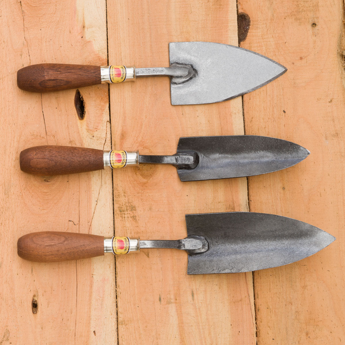 From left to right: Flat Trowel, PLanter's Trowel, Trowel