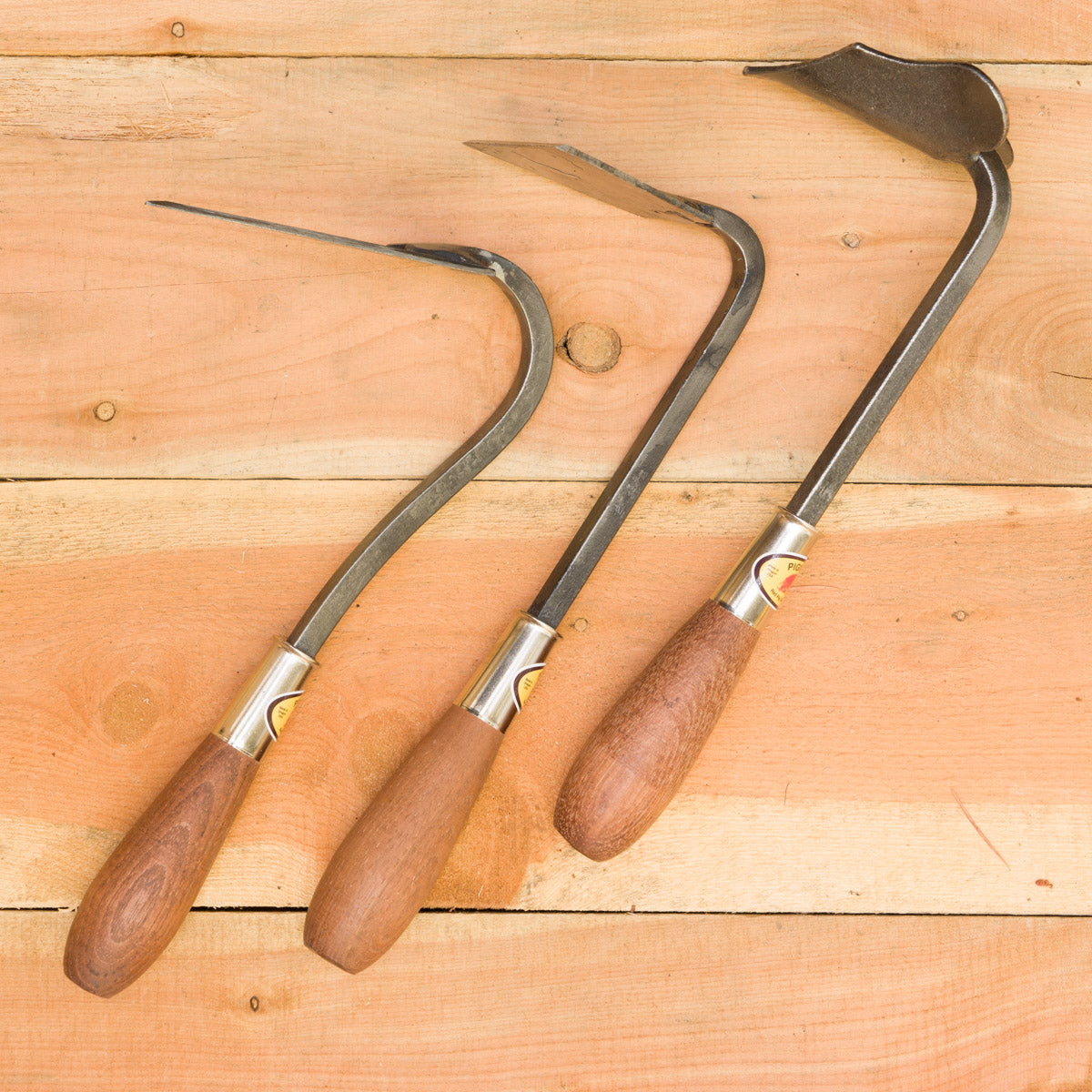 From left to right: V Hoe, Hand Hoe, Ridger