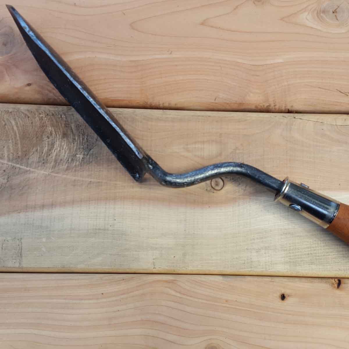 Potting Trowel for houseplant and container gardening. Upside down blade keeps hands away from plant in use.