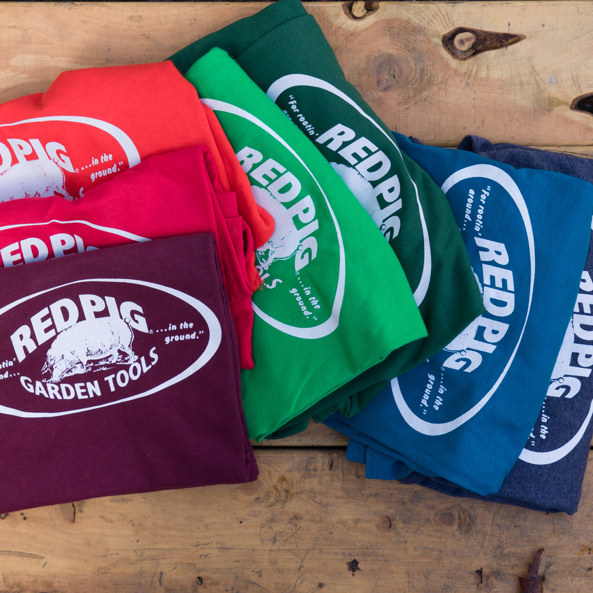 Red Pig shirts are available in a variety of colors in all gender sizes from small to XX large.