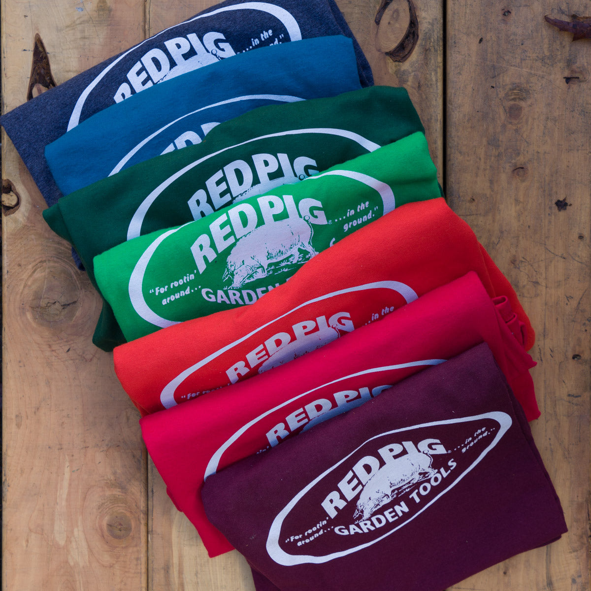 All shirts are 100% cotton except the grey heather, which is a poly/cotton blend.