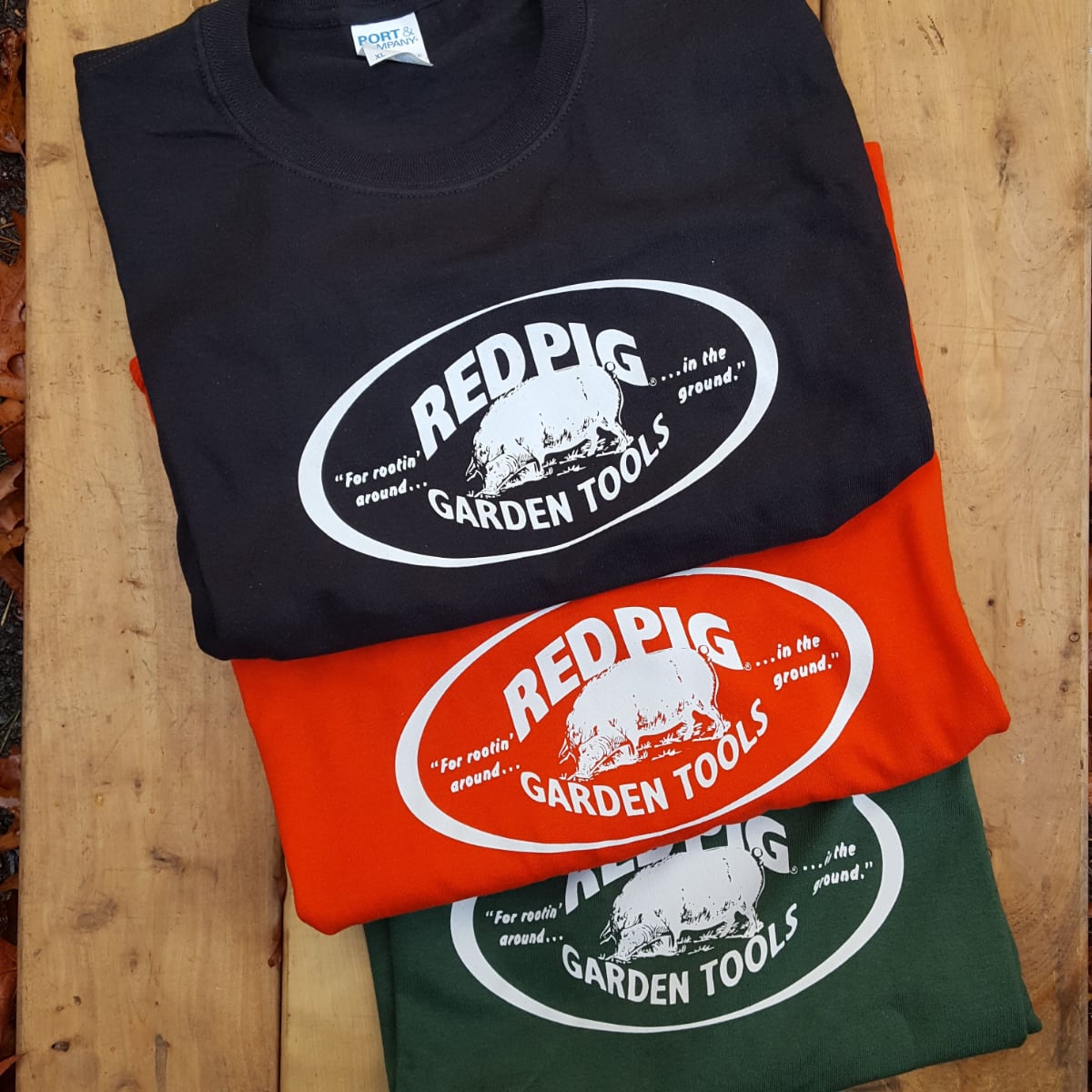 Black, orange red, and Forest green 100% cotton t-shirts.