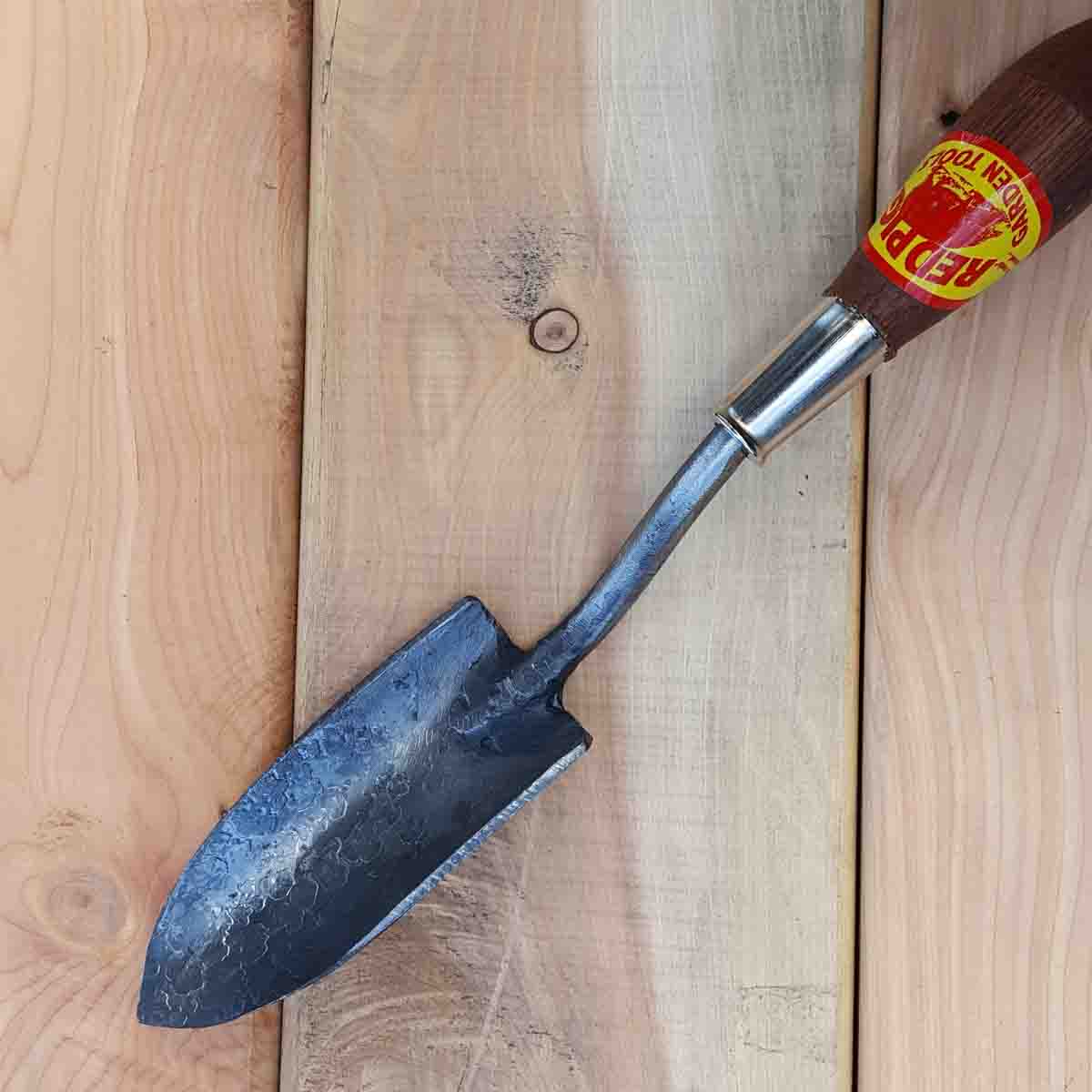 Our small trowel blade is approximately 1 inch shorter than our medium trowel blade and between 2 and 3 inches in width.