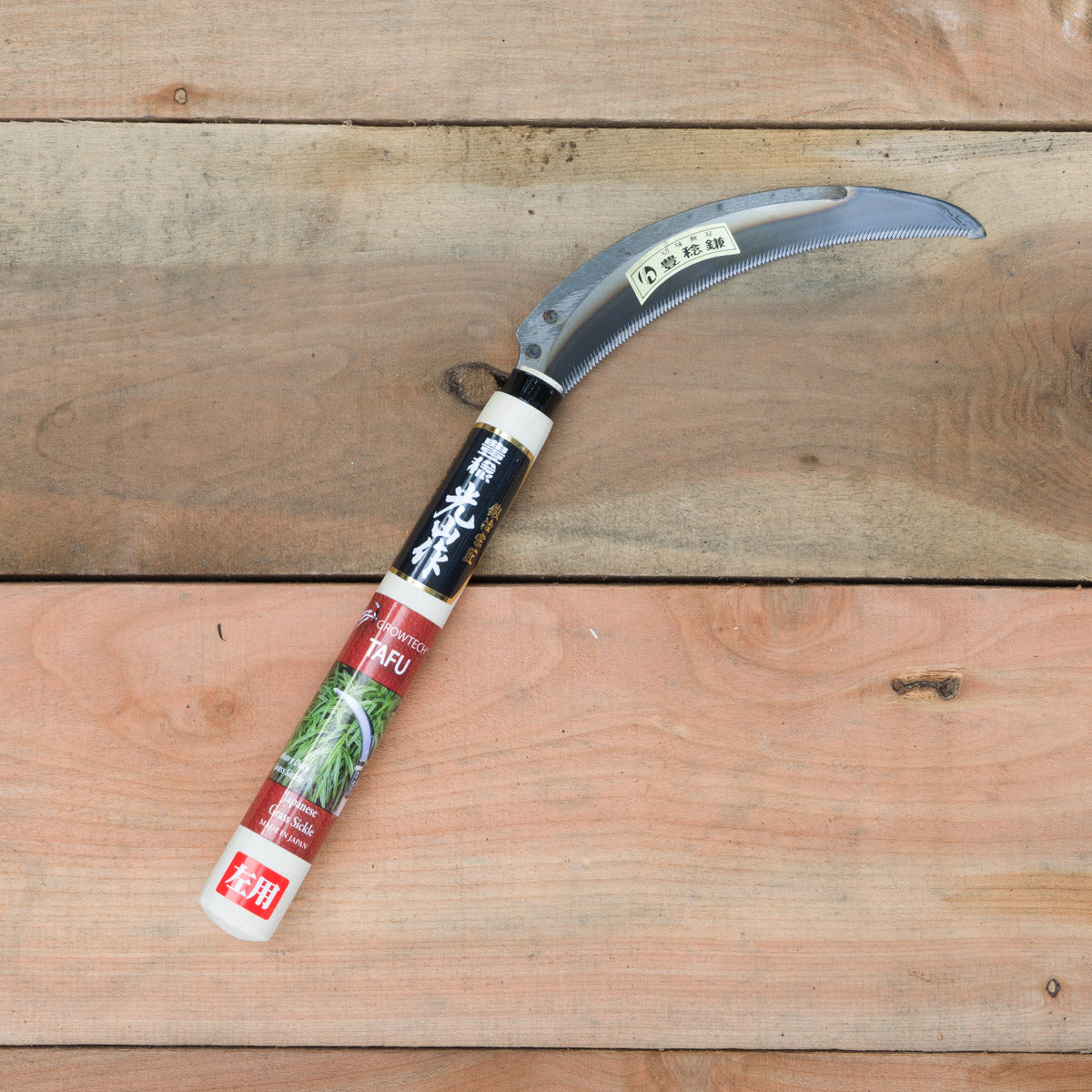 The tafu is a robust serrated sickle good for cutting tufted grasses. (Left handed version has serrations on opposite side.