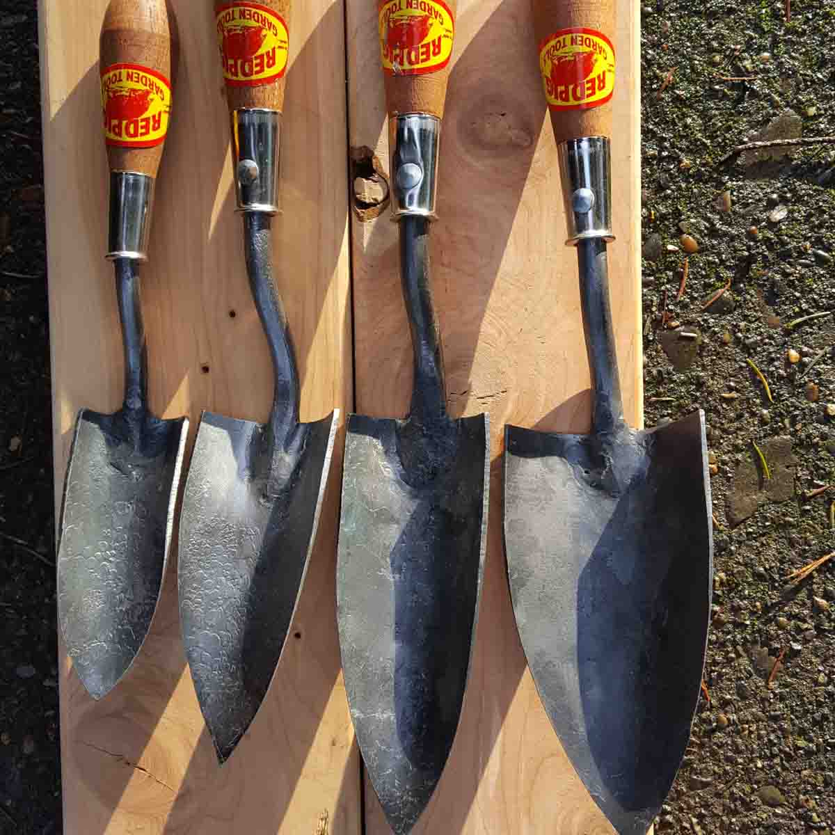 Small trowel is the 2nd from the left, between a medium and an extra small trowel.