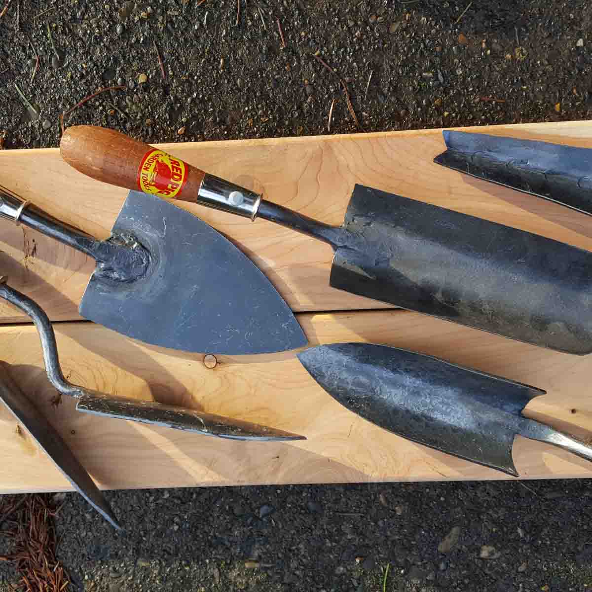 Transplant trowel in lower right, next to the "bigger holeabout".