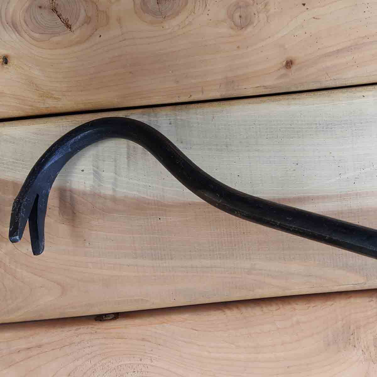 The weed yank lets you reach over the weed, grab it from the back side near the root, and pull.